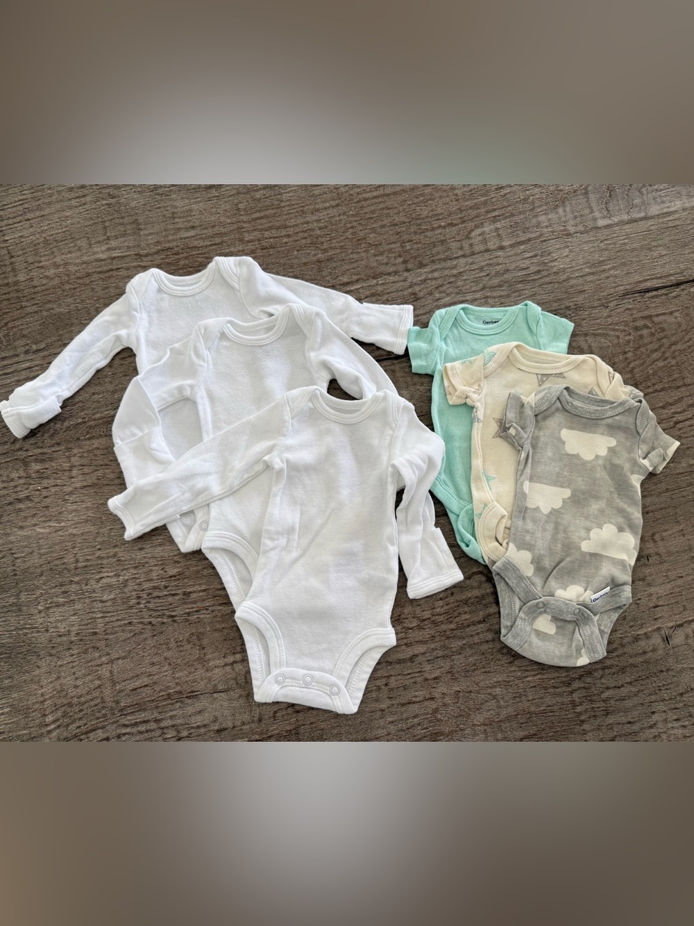 Carters and Gerber onesies size preemie hardly washed never worn.